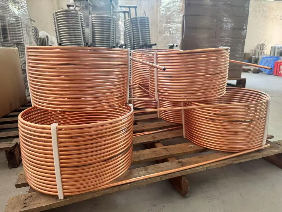 Custom formed copper tube coils arranged on factory pallets