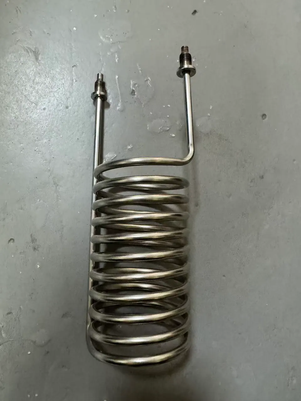 Stainless helical coil with threaded connection ends