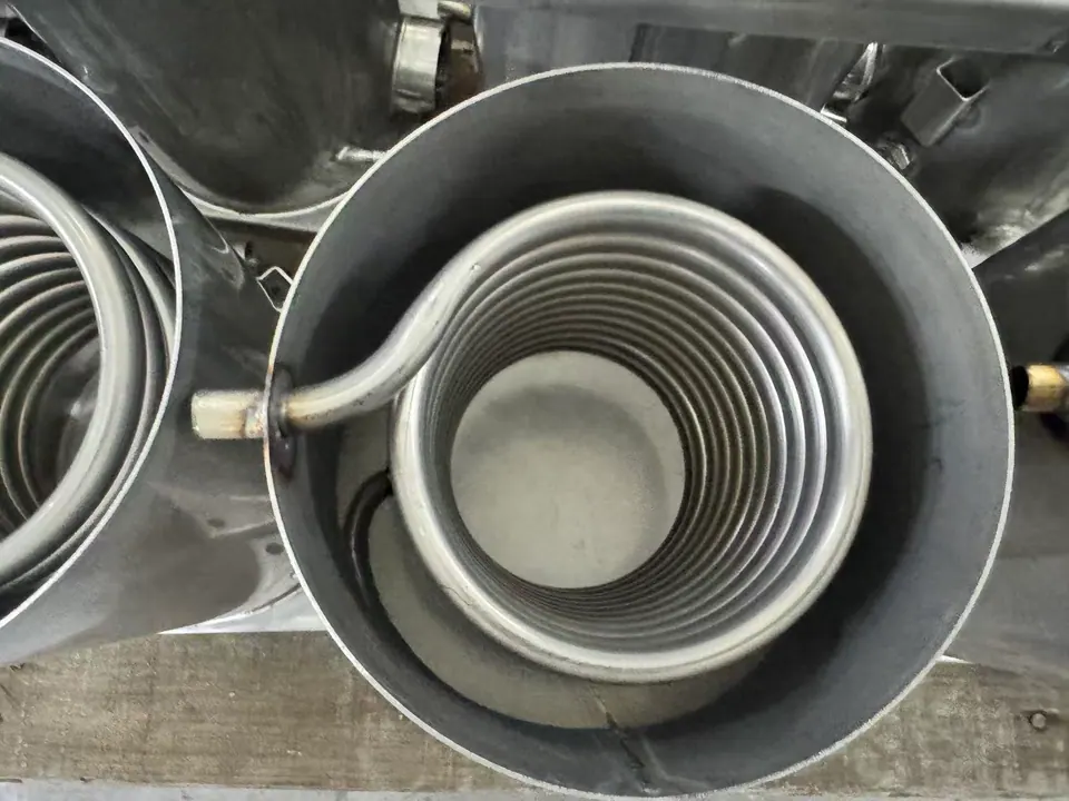 Stainless immersion coil installed inside a fabricated vessel